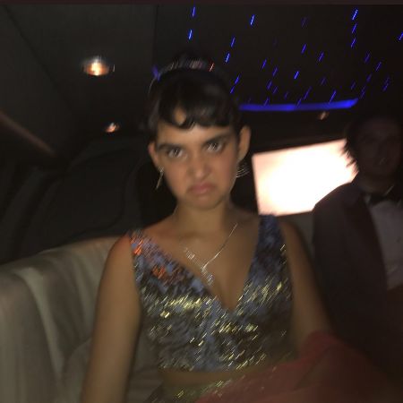 Miles Robbins and his girlfriend photographed together in a limo.